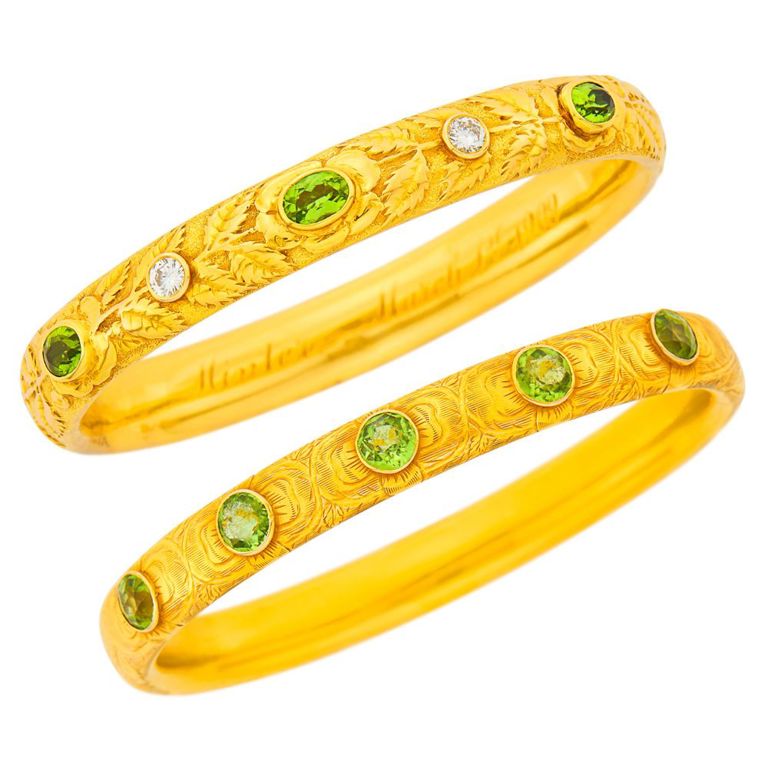 Two antique gold and peridot bangle bracelets