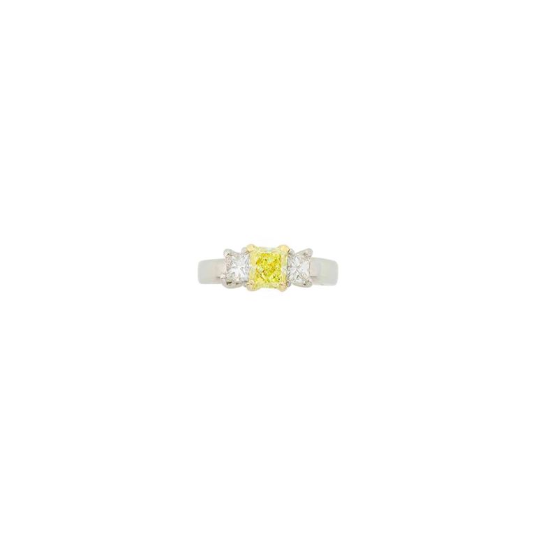 Platinum, gold, fancy yellow diamond and diamond ring