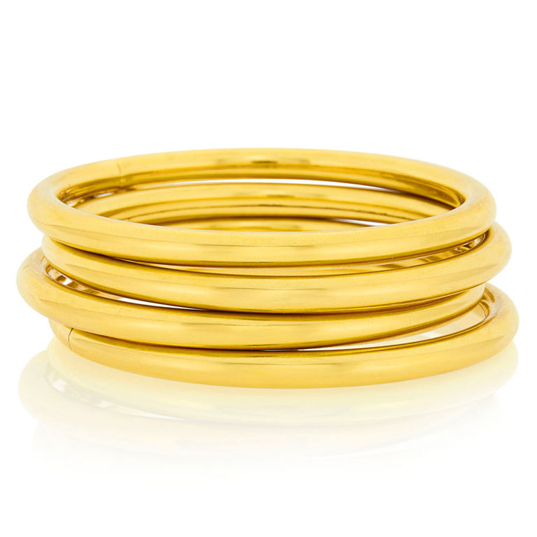 Four gold bangle bracelets