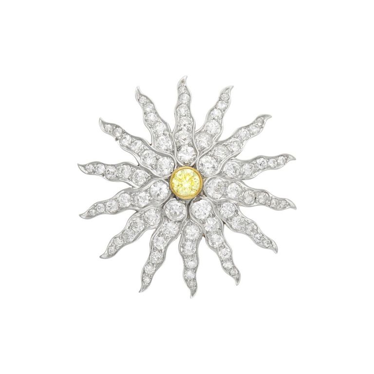 Antique platinum, gold, colored diamond and diamond starburst pendant-brooch