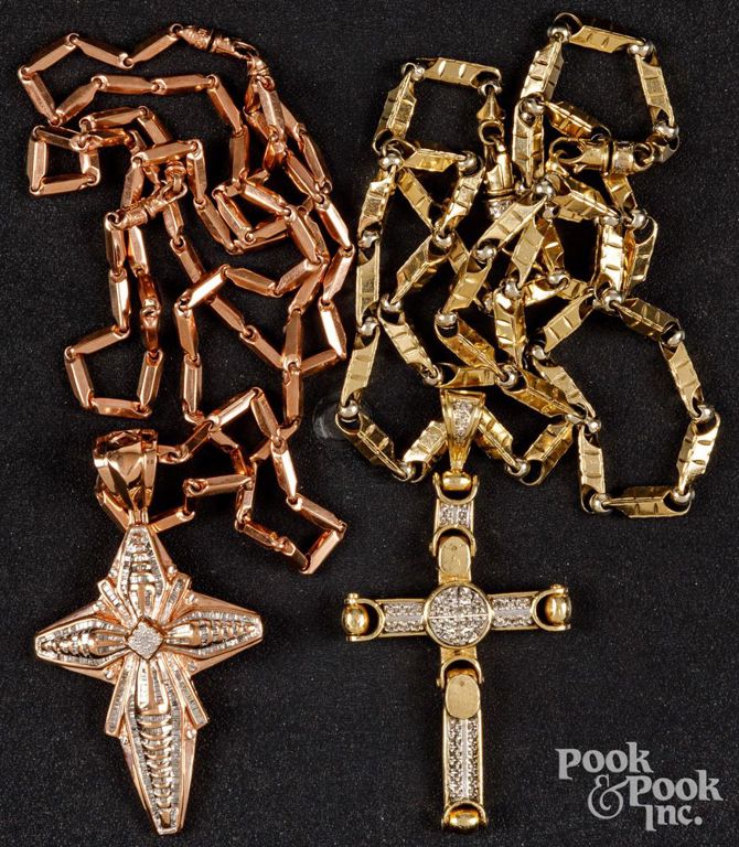 Two 10k gold diamond cross pendants on chains