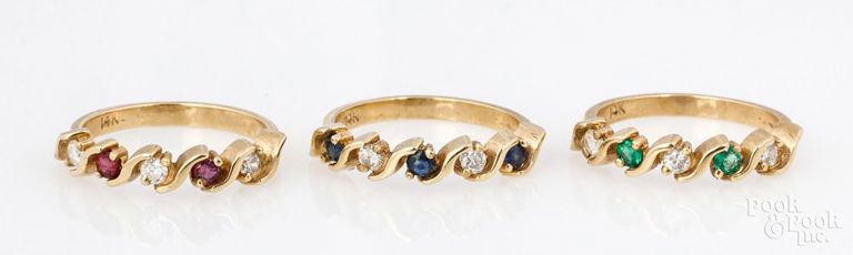Three 14k yellow gold diamond, rubie, emerald and sapphire rings