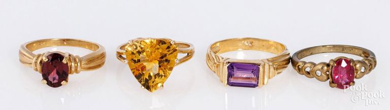 Four 14k yellow gold rings