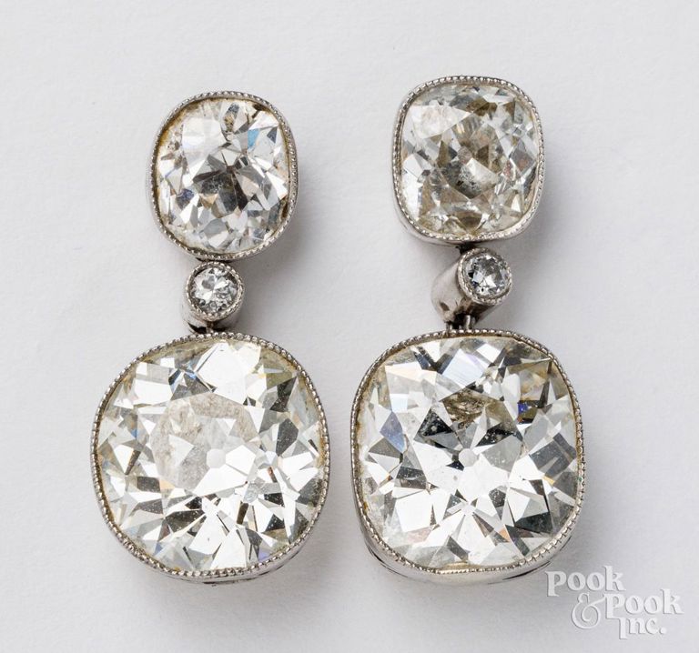 Platinum earrings and 14k gold diamond earrings