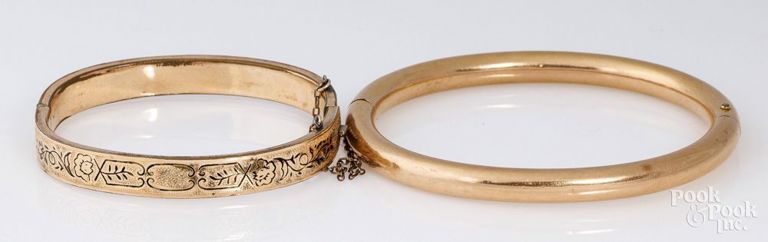 Two gold-plated bangle bracelets