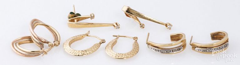 Four pairs of 14k yellow gold earrings