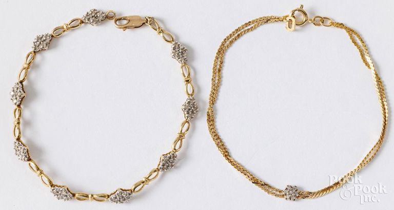 Two 14k yellow gold diamond bracelets