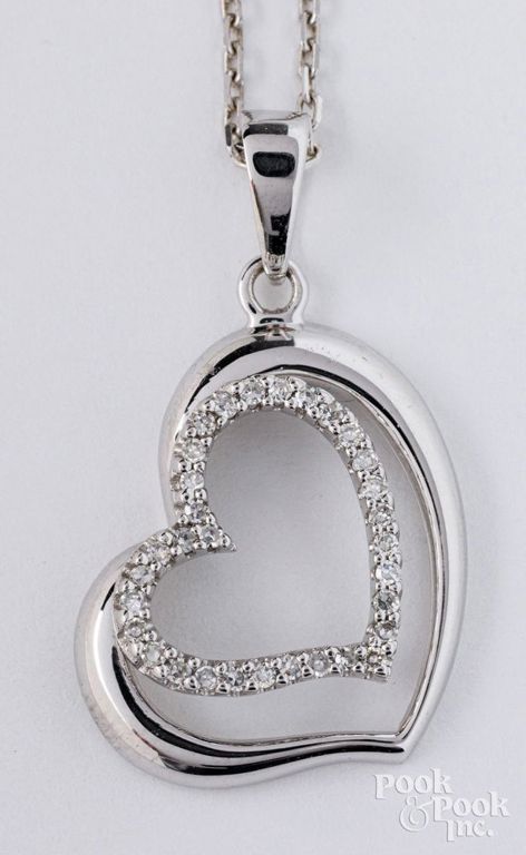 14k white gold diamond heart pendant on necklace