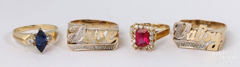 Four 14k yellow gold rings