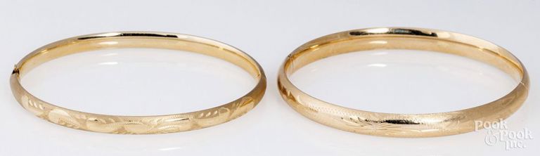 Two 14k yellow gold bangle bracelets