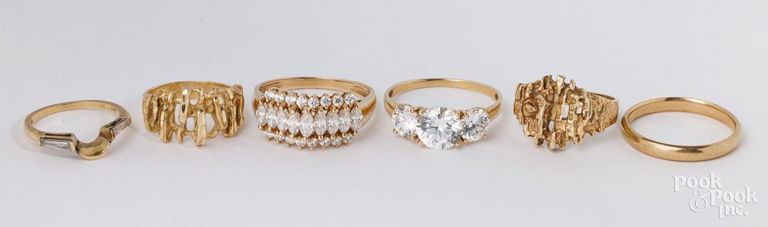 Six 14k yellow gold rings
