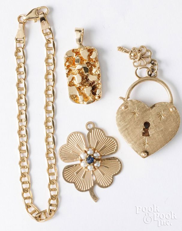 14k yellow gold bracelet and three 14k yellow gold charms