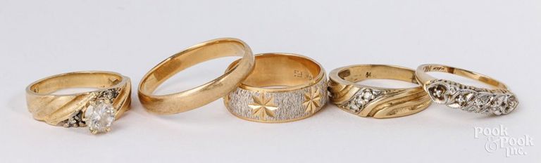 Five 14k yellow gold rings