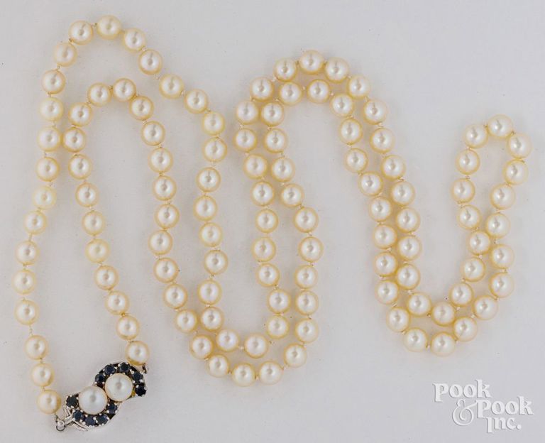 Pearl necklace with 14k white gold sapphire and pearl clasp