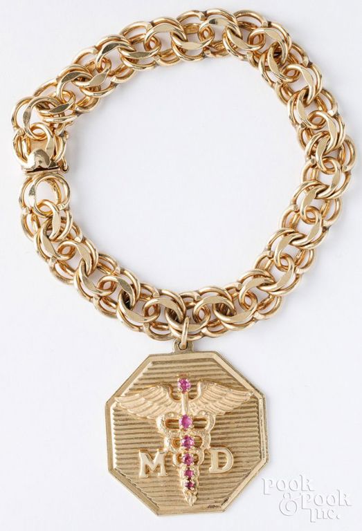 14k yellow gold bracelet with 14k yellow gold ruby charm