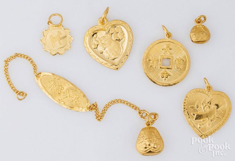 Four 22k yellow gold pendants and 22k yellow gold bracelet