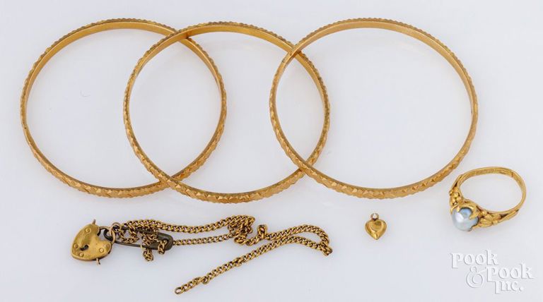 Three 21k yellow gold bracelets with 22k yellow gold jewelry