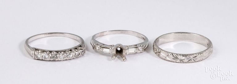 Platinum engagement ring and two platinum wedding rings