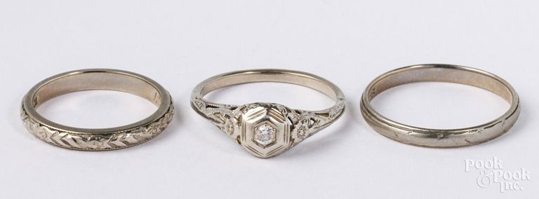 Two 18k white gold wedding rings and 14k white gold engagement ring