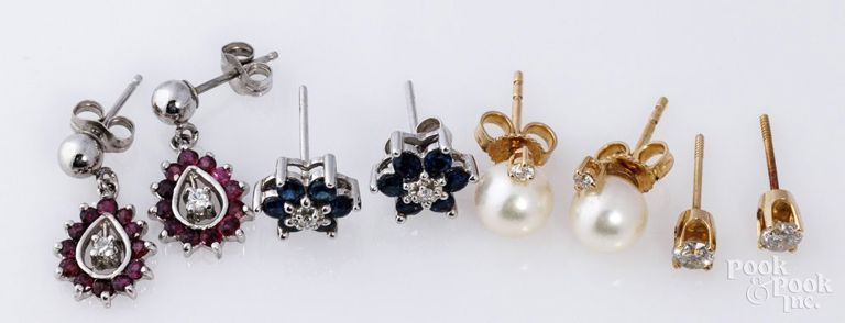 Four pairs of 14k gold earrings