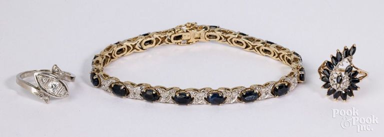 Two 14k gold rings and sterling silver bracelet