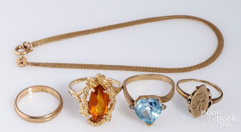 14k yellow gold ring and bracelet with three 10k gold rings
