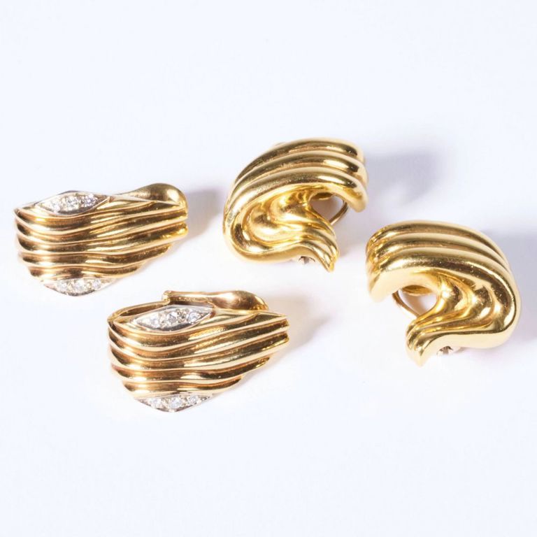 Two pairs of gold earclips with diamonds