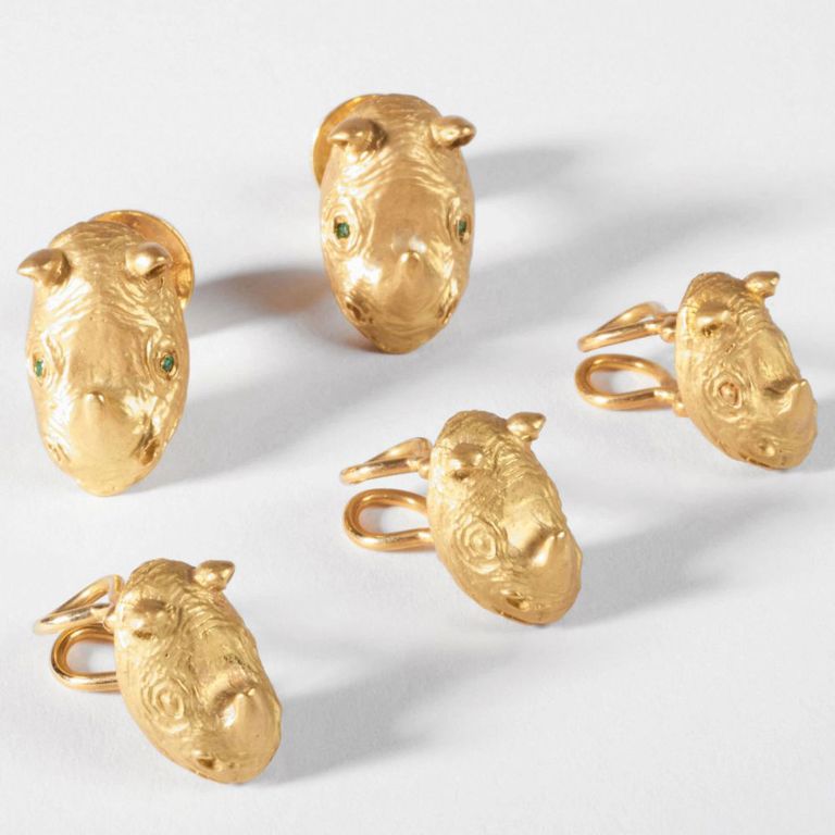 18k gold rhinoceros head dress set with green gem eyes