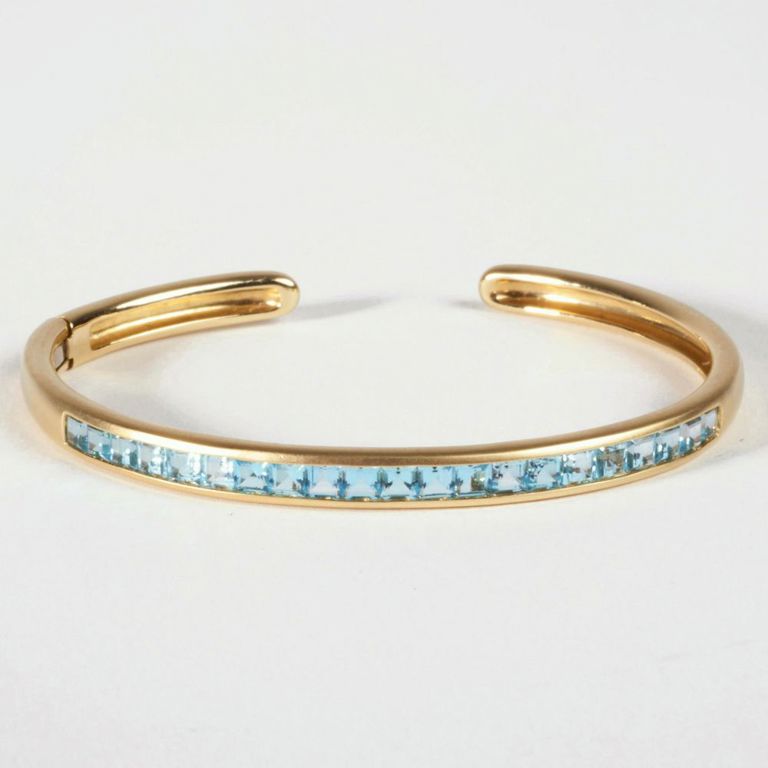 14k gold blue topaz bangle bracelet