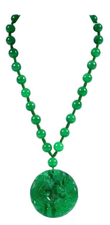 14k yellow gold necklace with carved jade pendant