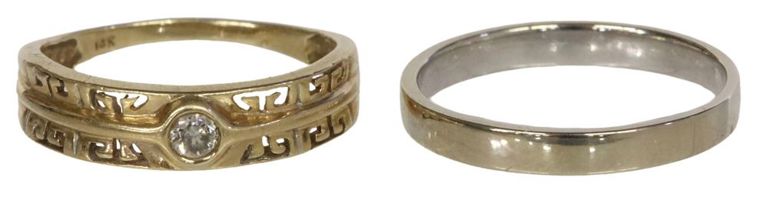 14k yellow gold diamond solitaire ring and 14k white gold flat band