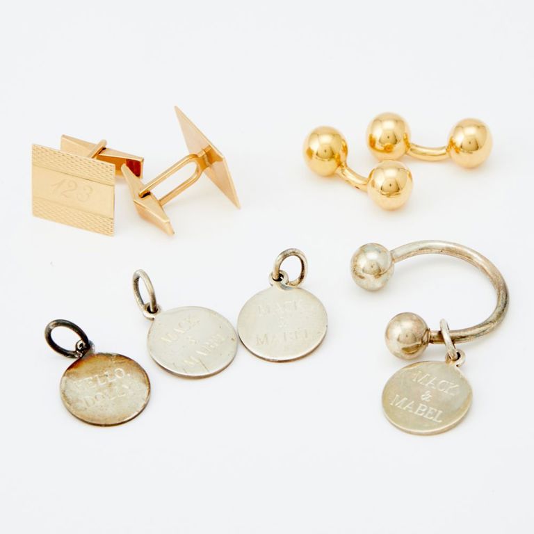 Two pairs of gold cufflinks and Tiffany & Co. silver key ring with charms