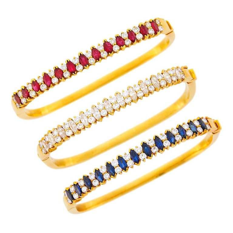 Three gold gem-set diamond bangle bracelets
