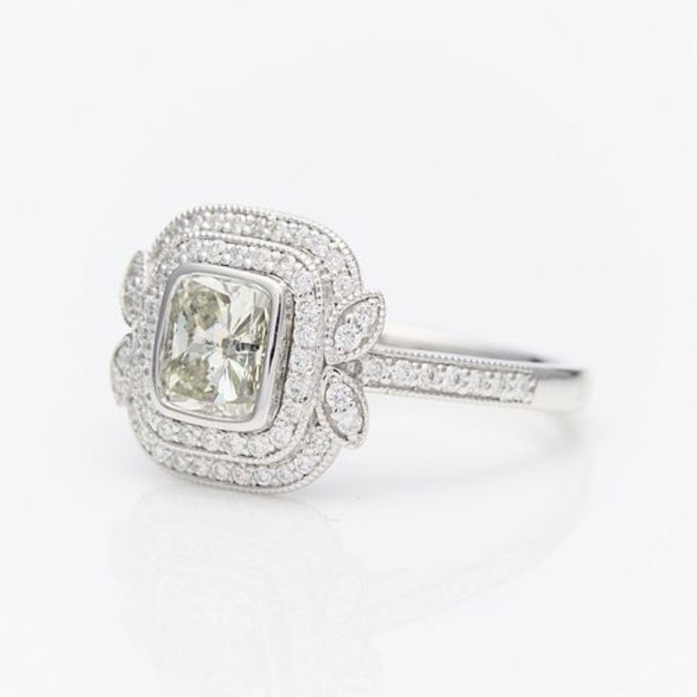 Platinum cushion cut diamond ring with double halo