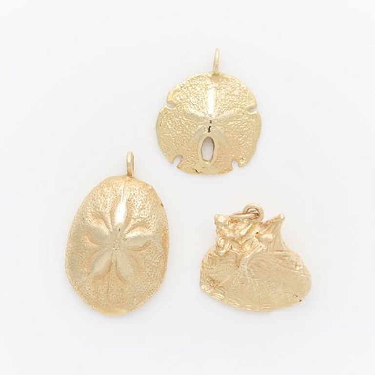 Group of three 14k yellow gold sea life pendants