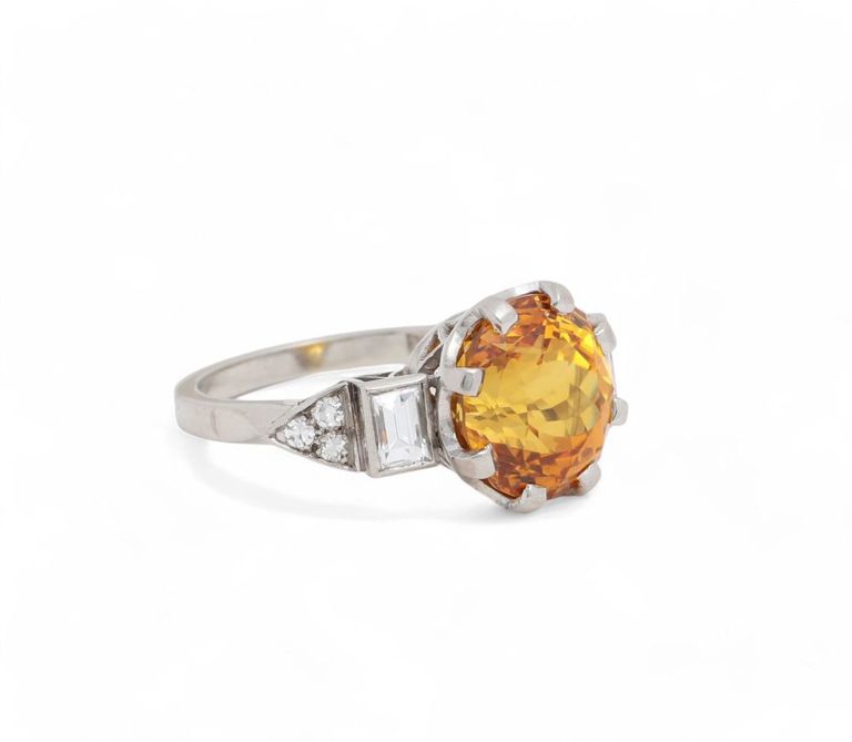 Platinum orange sapphire and diamond ring