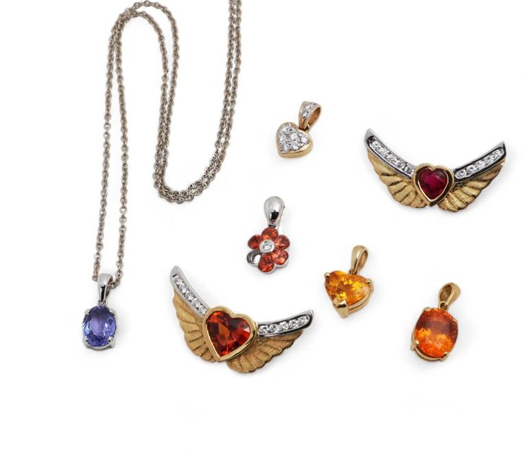 A collection of diamond, gemstone and gold pendants