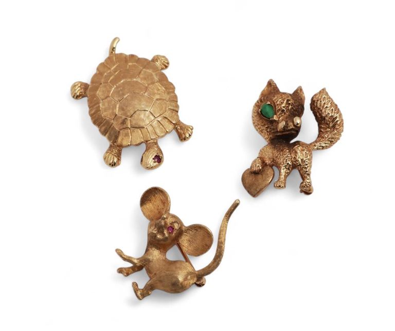 A collection of three stone and 14k gold animal brooches