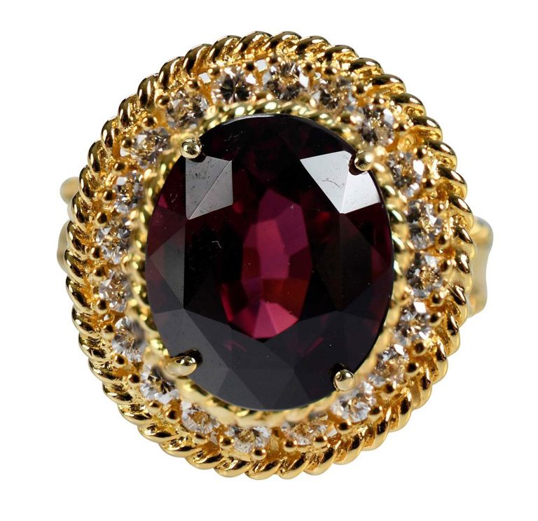 Yellow gold halo garnet ring