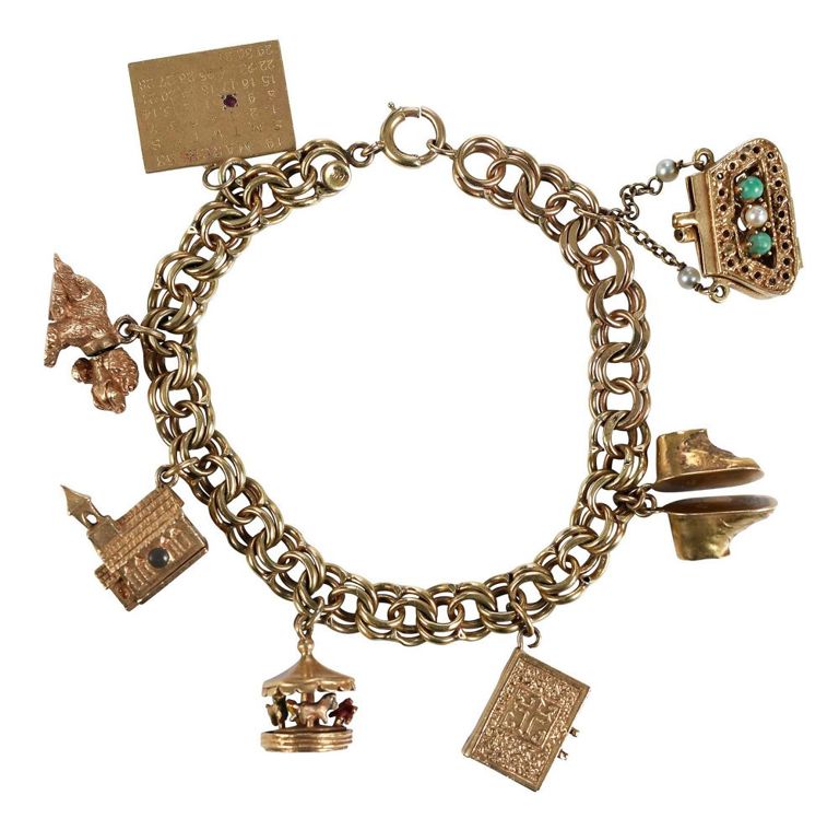 14k gold charm bracelet with eight charms