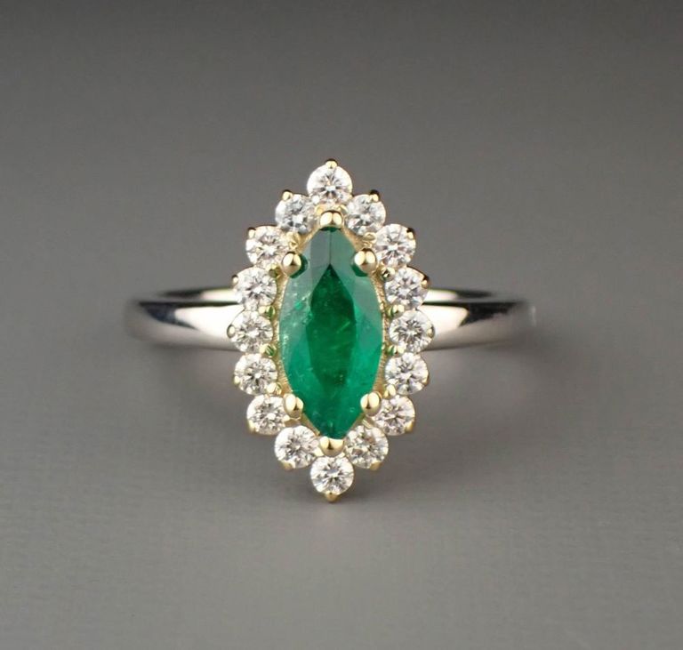 Platinum gold emerald diamond ring