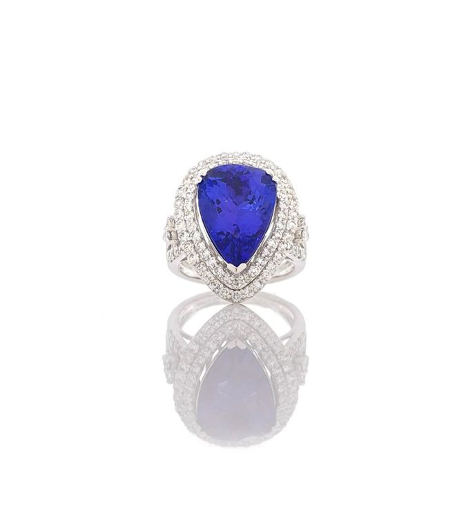 Platinum tanzanite diamond halo ring