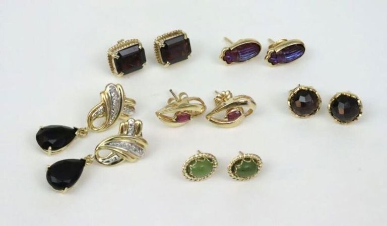 Six pairs of 14k gold pierced earrings