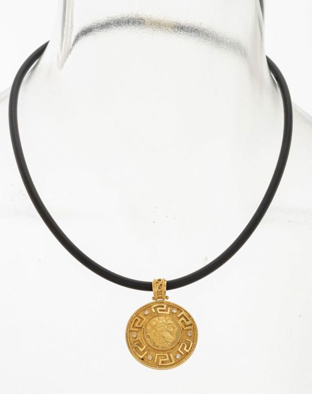 14k gold Greek coin style pendant on cord necklace