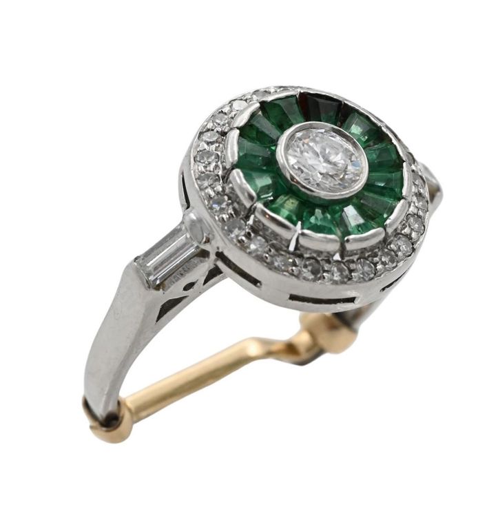 Platinum diamond and emerald halo ring