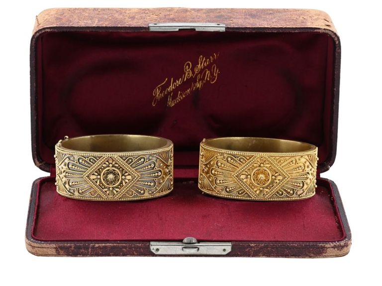 Two 14k yellow gold hinged bangle bracelets