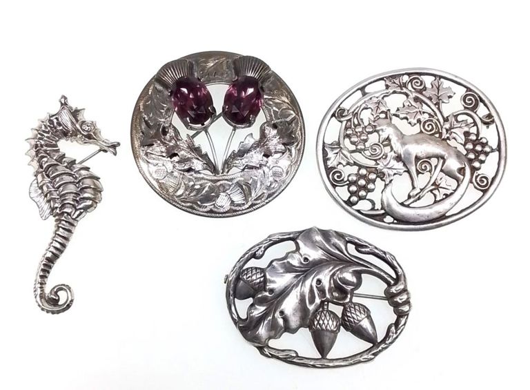 Sterling silver brooches set