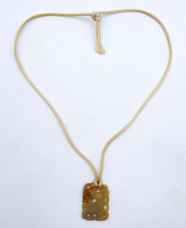 Carved stone bird pendant