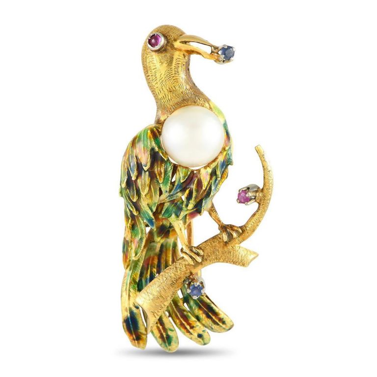 18k gold bird brooch with gemstones