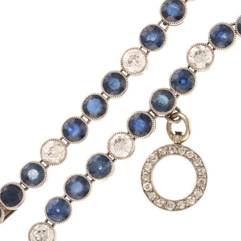 Platinum sapphire and diamond charm bracelet